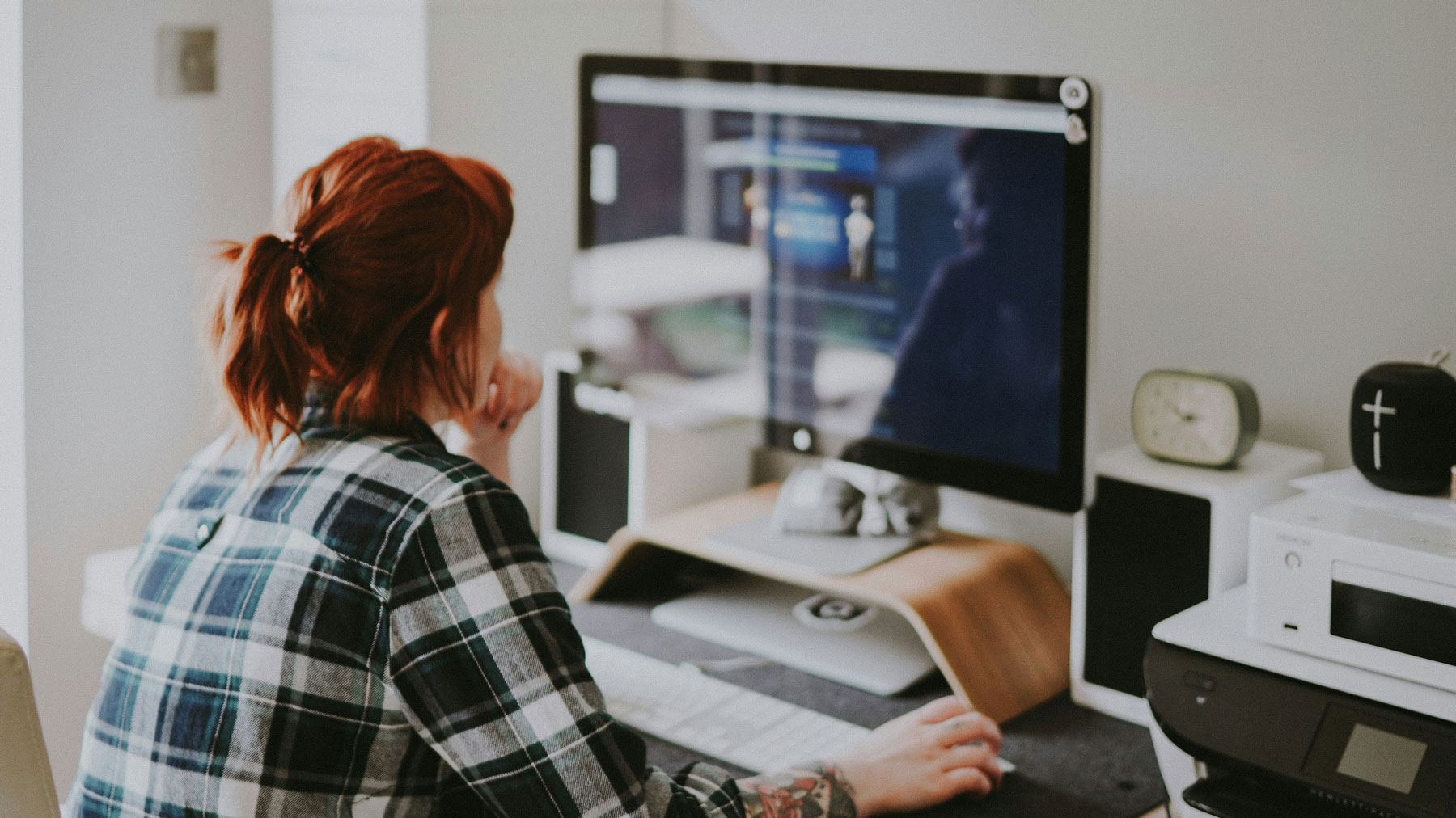 Woman business owner making website updates on computer