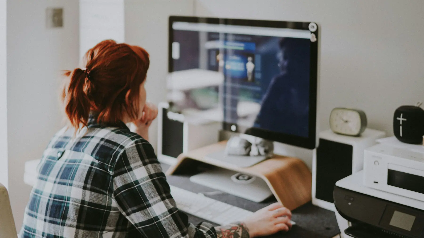 Woman business owner making website updates on computer