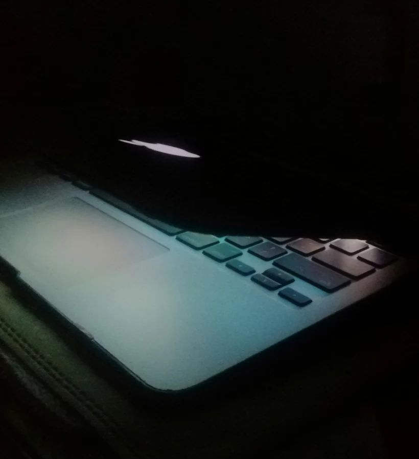 laptop peaking at lit from within